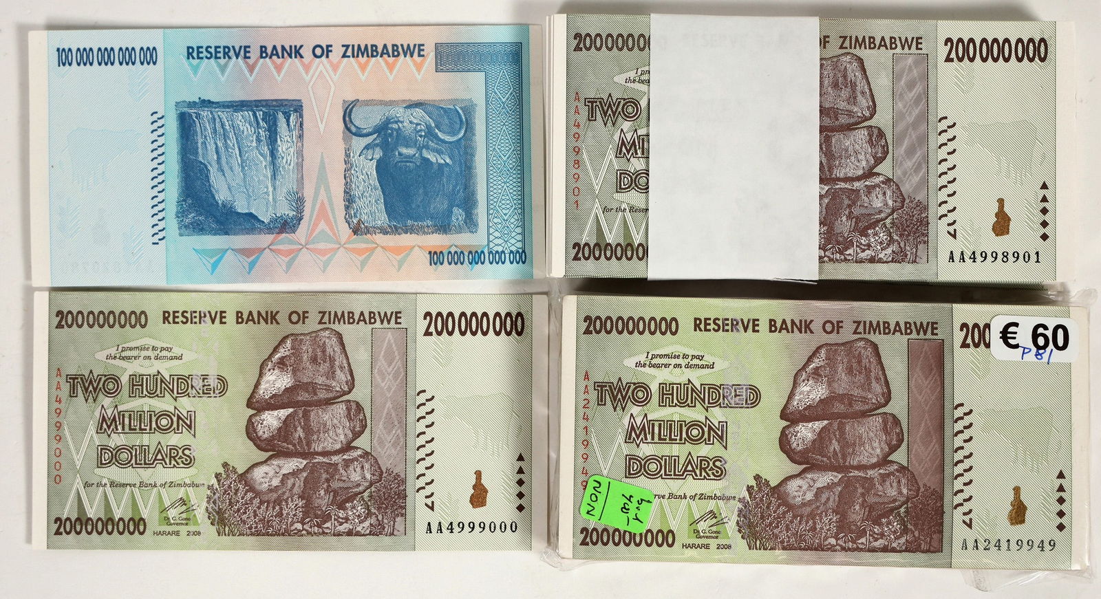 Currency of Zimbabwe [183937]: Two packets of 100 Two Hundred Million Dollars and one . One bill at one hundred trillion dollars. 2008 issue date. In new condition. ^Date: 2008Country (if not USA): AfricaState: City: Provenance: