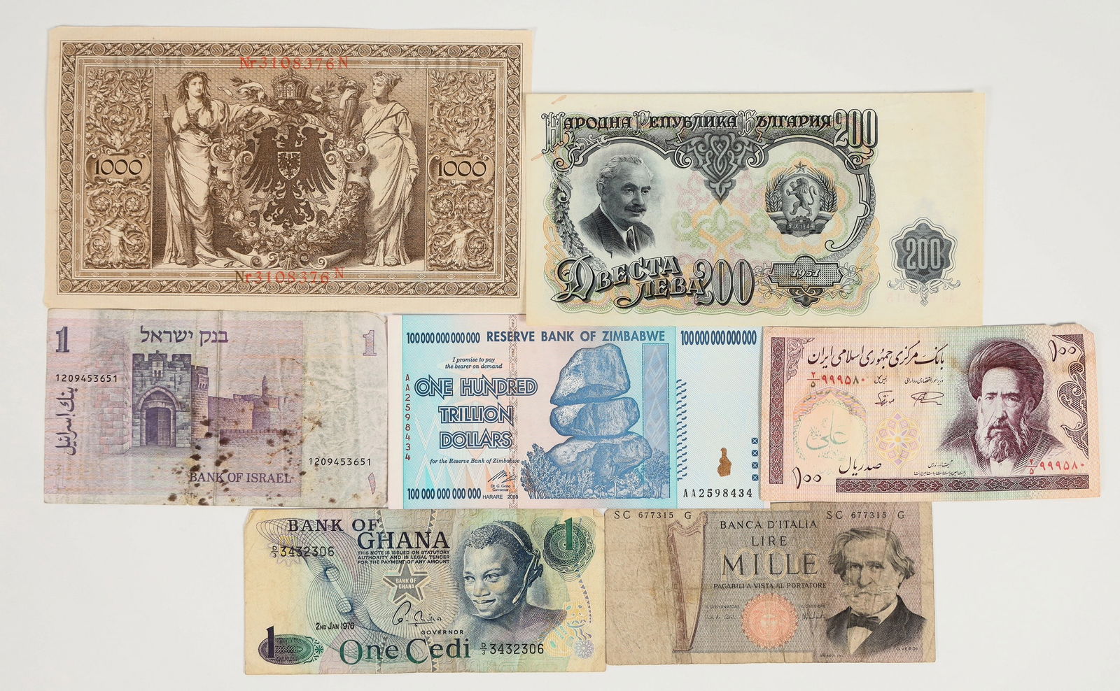 Foreign Paper Currency - ONE HUNDRED TRILLION DOLLARS! [191971]: Six pieces of paper currency from six countries: Iran - 100 Rials; Israel - 1 Shekel; Ghana - 1 Cedi; Zimbabwe - 100 Trillion Dollars; Bulgaria - 200 Lev; Germany - 1000 Marks. All are in good conditi