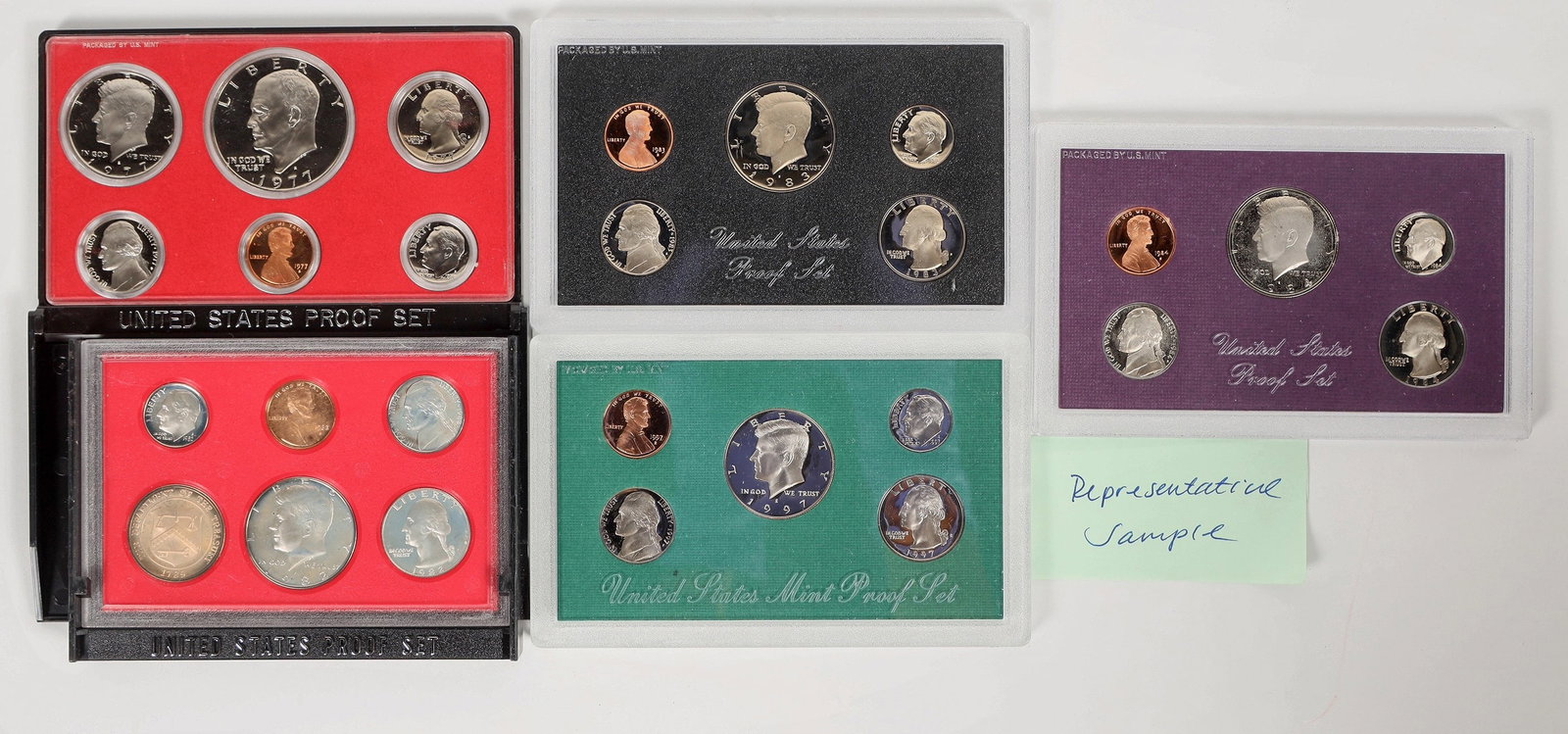 U.S. Proof Sets 1974-1997 (29) [201509]: Dealer lot of 29 U. S. Proof sets in original packaging 1974-1997. 1974 (2); 1975 (2); 1977 (2); 1980 (2); 1982 (2); 1983 (2); 1984 (2); 1985 (2); 1987 (3); 1989 (2); 1990; 1991; 1992; 1992 silver pro