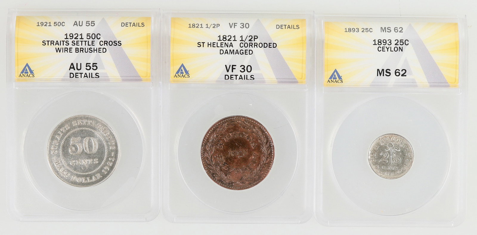 Ceylon/St. Helena/Straits Settlements Coins (3) [199850]: 1) Straits Settlements: KM# 35.1: ANACS graded AU 55 Details, wire brushed. Obv.: Crowned bust facing left / GEORGE V KING AND EMPEROR OF INDIA. Rev.: -STRAITS SETTLEMENTS-/ 50 / CENTS / HALF DOLLAR 1