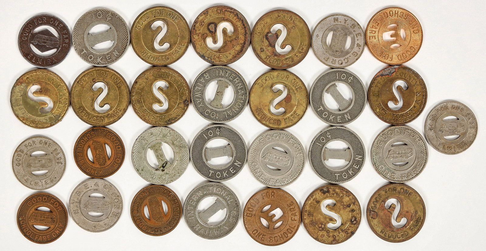New York Transportation Tokens (29) [197856]: Lot of 29 transportation tokens: Lockport Bus Lines; International Railway Co.; Suffolk County Bus Tokens; Elmira Motor Coach Corp. ^Date: Country (if not USA): State: New YorkCity: Provenance: