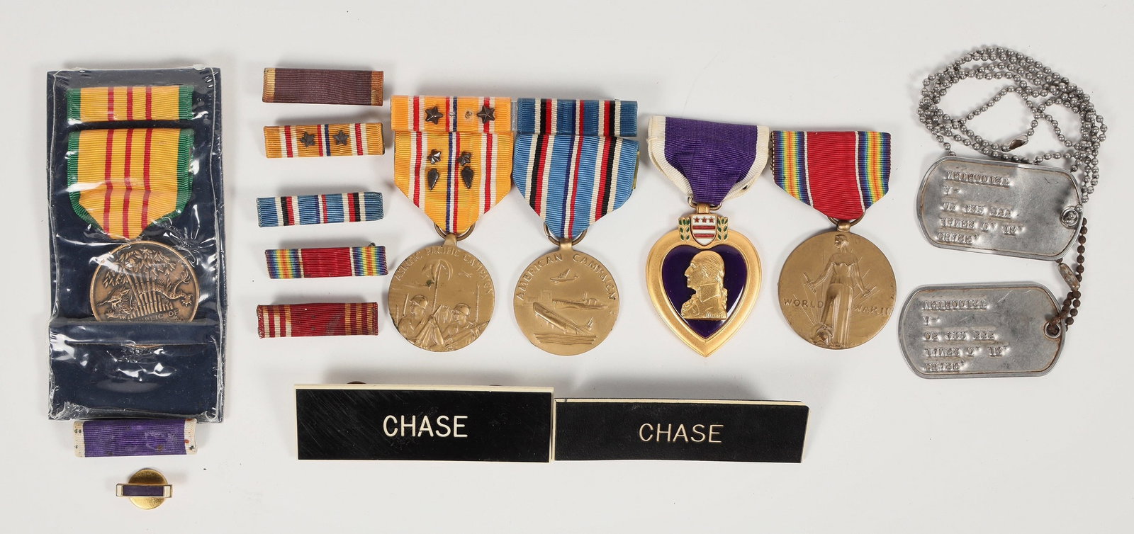 WWII and Viet Nam Medals and Ribbons. [201157]: Lot of 13. 1. Purple Heart in case w. ribbon and small ribbon. Issued to Harvey F. Scallion. 2. Dog Tags, name tags for James Chase. 3. WWII medals, unknown if issued to Chase. : Asiatic Campaign meda
