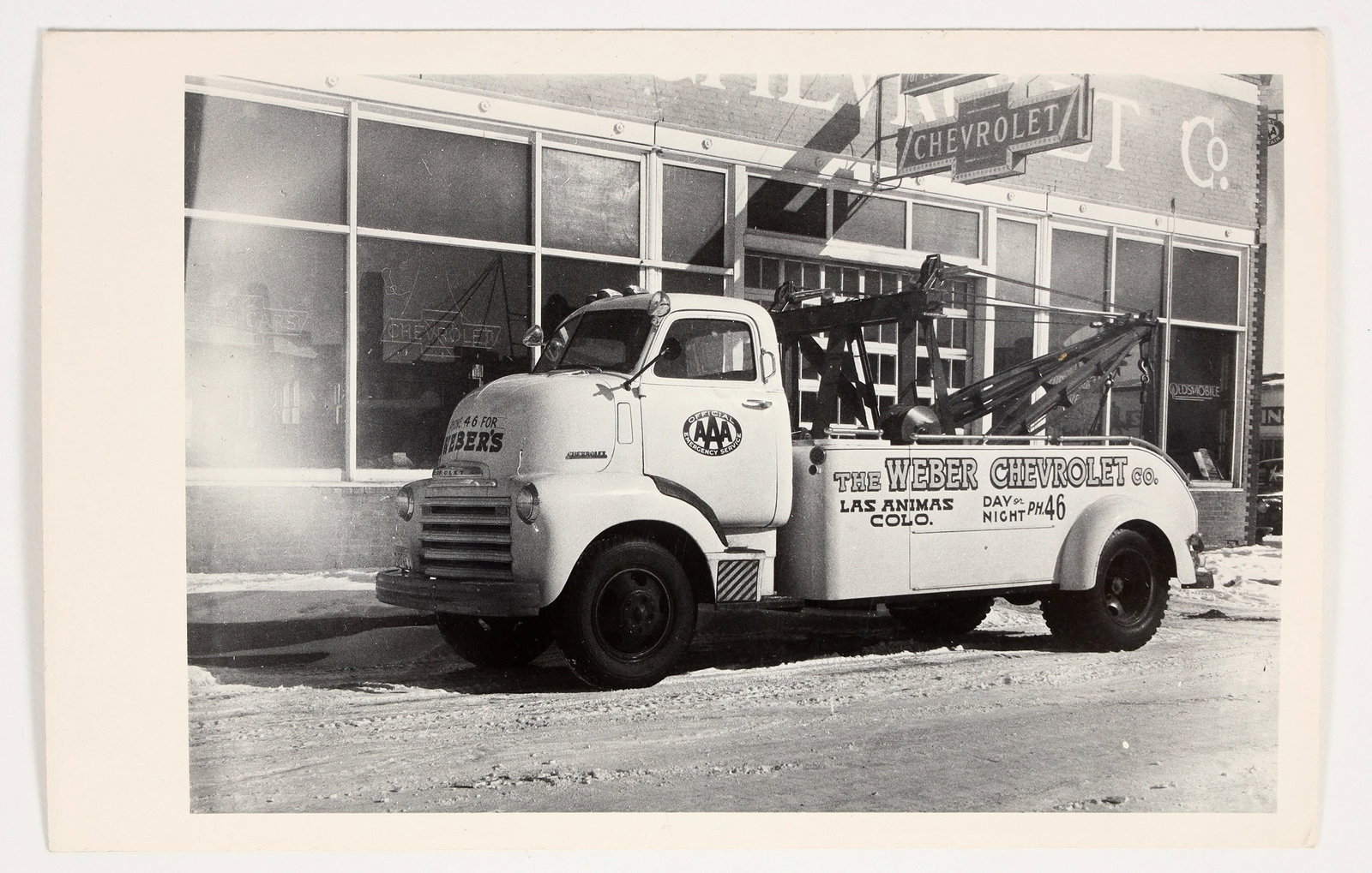Las Animas Colorado Real Photo Postcard [201142]: This lot is a black and white real photo postcard of the Weber Chevrolet Company truck in Las Animas, Colorado. Postcard is in excellent condition with no tears or stains and is not written on. ^Date: