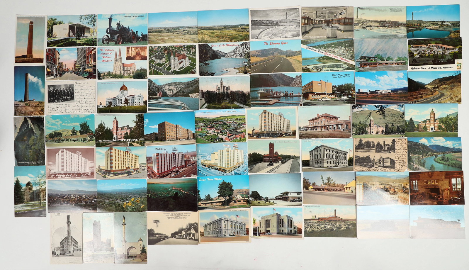 Montana Cities Postcard Group (61) [201456]: Group of 61 postcards depicting cities/large towns in Montana, dating c. 1906-1974. Lot includes 28 Missoula postcards, 14 Helena postcards, 12 Great Falls postcards, and 7 Billings postcards. 9 used.