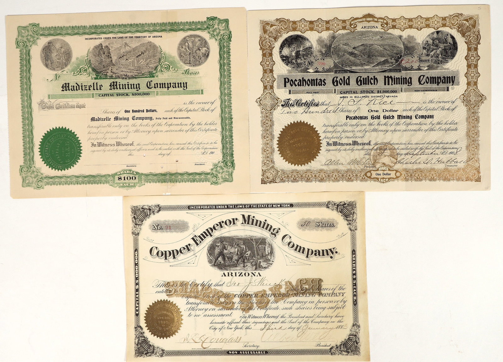 Arizona Mining Stocks [200246]: Lot of 3. U/C, I/U. 1. Madizelle Mining Co. , dateline 190_, two embossed seals, vignettes: top miners in mine and of the topside of mine. 2. Copper Emperor Mining Co. issued in 1883. Incorporated in 