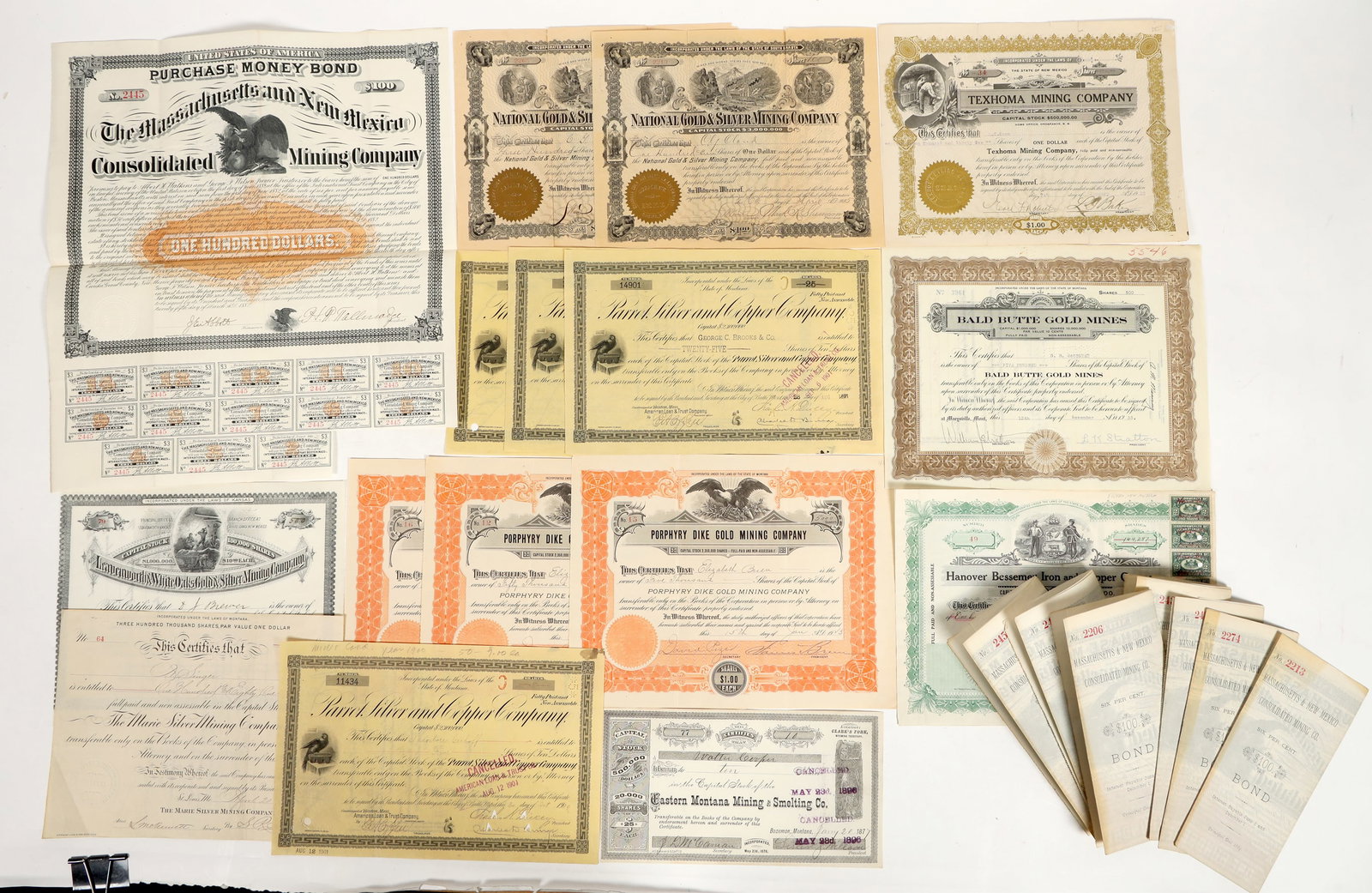 New Mexico and Montana Mining Stock/Bonds [205293]: Lot of 24. I/U, I/C. Fair or better condition. Some with revenue stamps. Company I.E.; Massachusetts & New Mexico Consolidated Mining Co. , issued 1882, coupons. Samuel Hobbs & Co. printer. Hanover Be