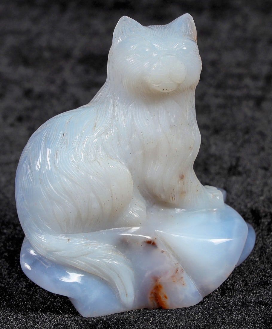 Blue Chalcedony Cat Statuette, c. 1900-1920 [201589]: An excellent statuette of a cat carved from a large piece of pale blue chalcedony. Wonderfully made piece; the fur is rendered in detail, and the cat has lifelike proportions and a charming face. Natu