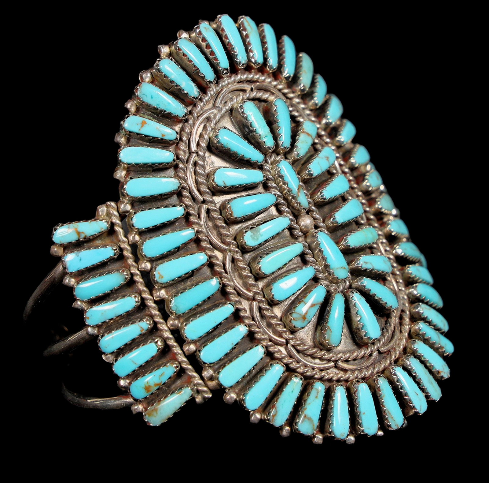 Petite Point Turquoise Cuff [200070]: This Turquoise Petite Point cuff was actually made in the Zuni Style by Navajo Silversmith Martin Byjoe, the cuff contains 76 pieces of Sleeping Beauty turquoise, the opening measures at 1 1/2" and 2
