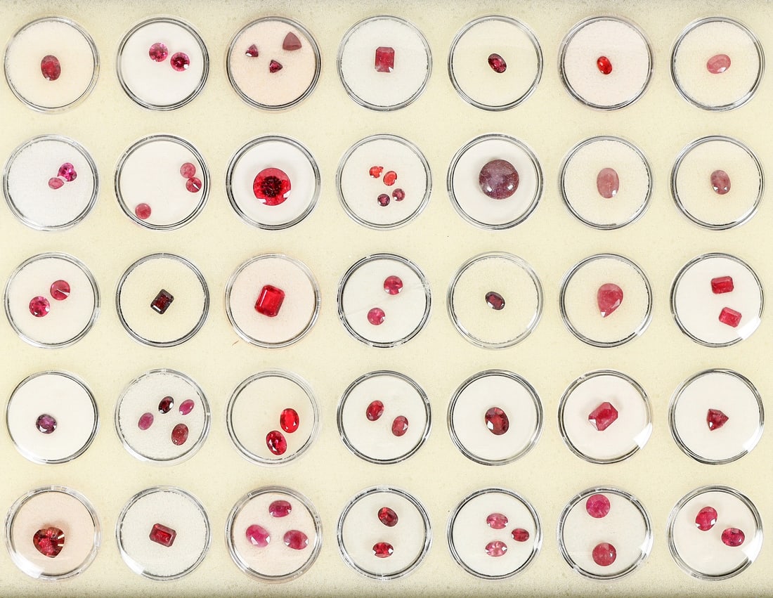 Faceted and Polished Ruby Collection [204051]: Faceted and Polished Ruby Collection in 1" circular gem holders. 35 containers overall of different faceted rubies of varying sizes. About 60 pieces overall. Excellent variety of sizes and color. Some