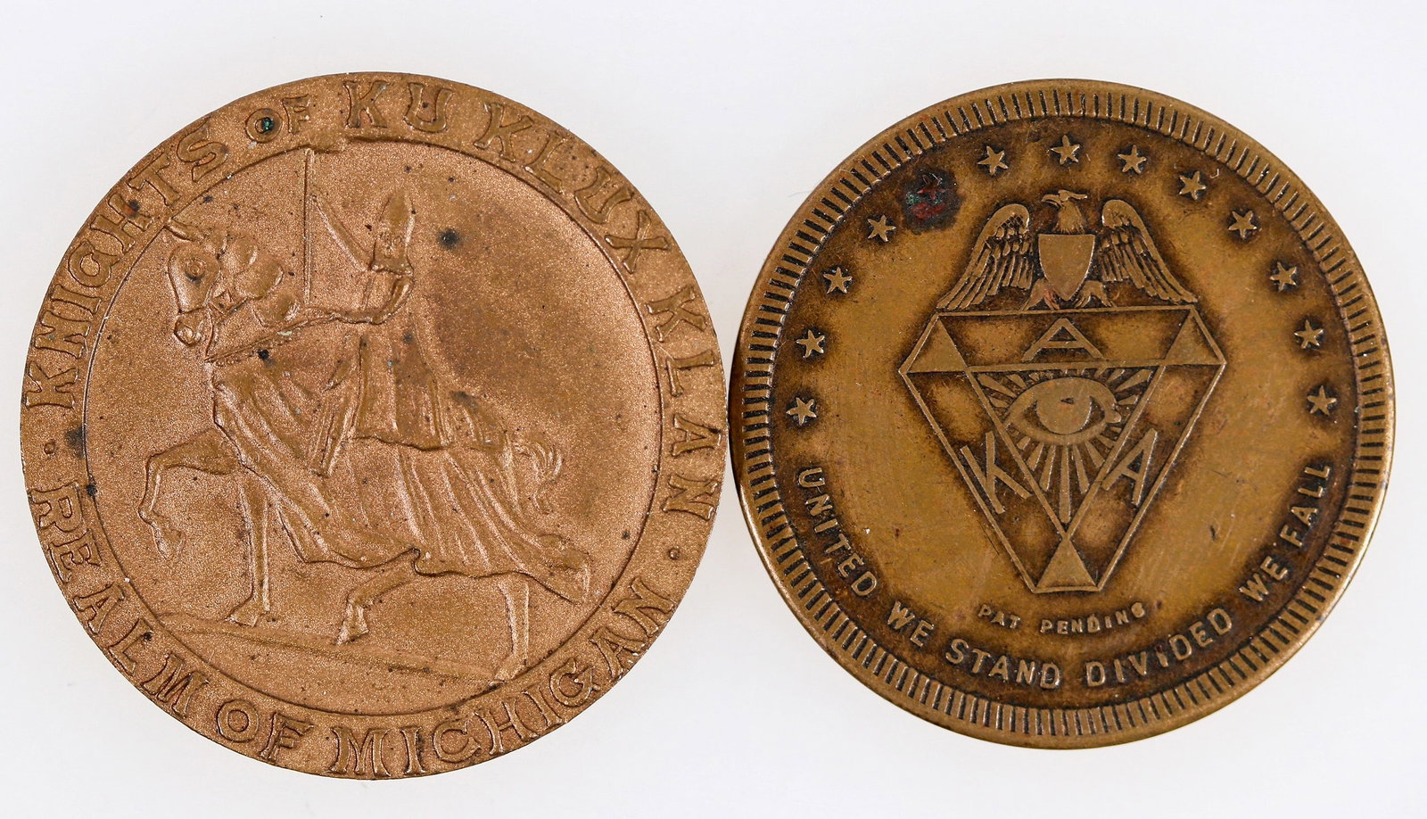 Ku Klux Klan Medals (2) [204868]: Lot of two: 1) Knights of Ku Klux Klan / Realm of Michigan // Member in Good Standing; Br., rd., 32 mm. 2) United We Stand Divided We Fall // A Chivalric Head / A Prudent Tongue / A Courageous Will / 