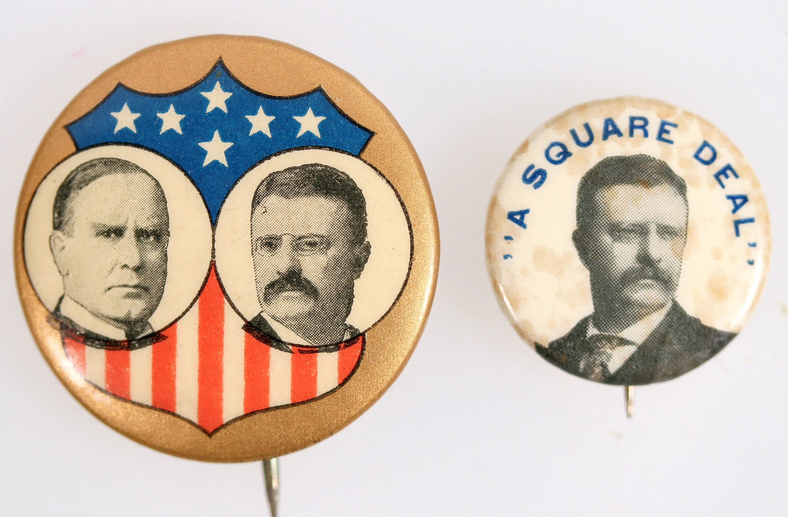 Presidential Campaign Pinbacks [201387]: Lot of 2. 1. Theodore Roosevelt Presidential 1904 pinback. Single photo of Roosevelt. Ehrman mfg. printer. 2. McKinley and Roosevelt 1900 campaign pinback. US Shield w/photos of both on shield. Whiteh