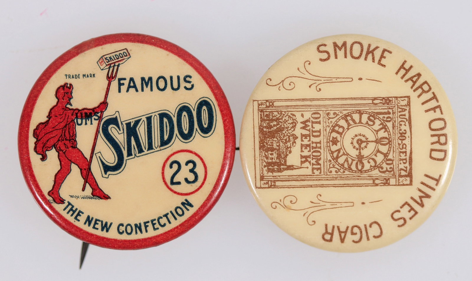 Advertising Pinbacks [201228]: Lot of 2. 1. Famous Skidoo 23 w/devil holding pitchfork and box of Skidoo on it. Made by Whitehead & Hogg Co. 1896. 2. Smoke Hartford Times Cigar Made by Whitehead & Hogg Co. 1896^Date: 1896Country (i
