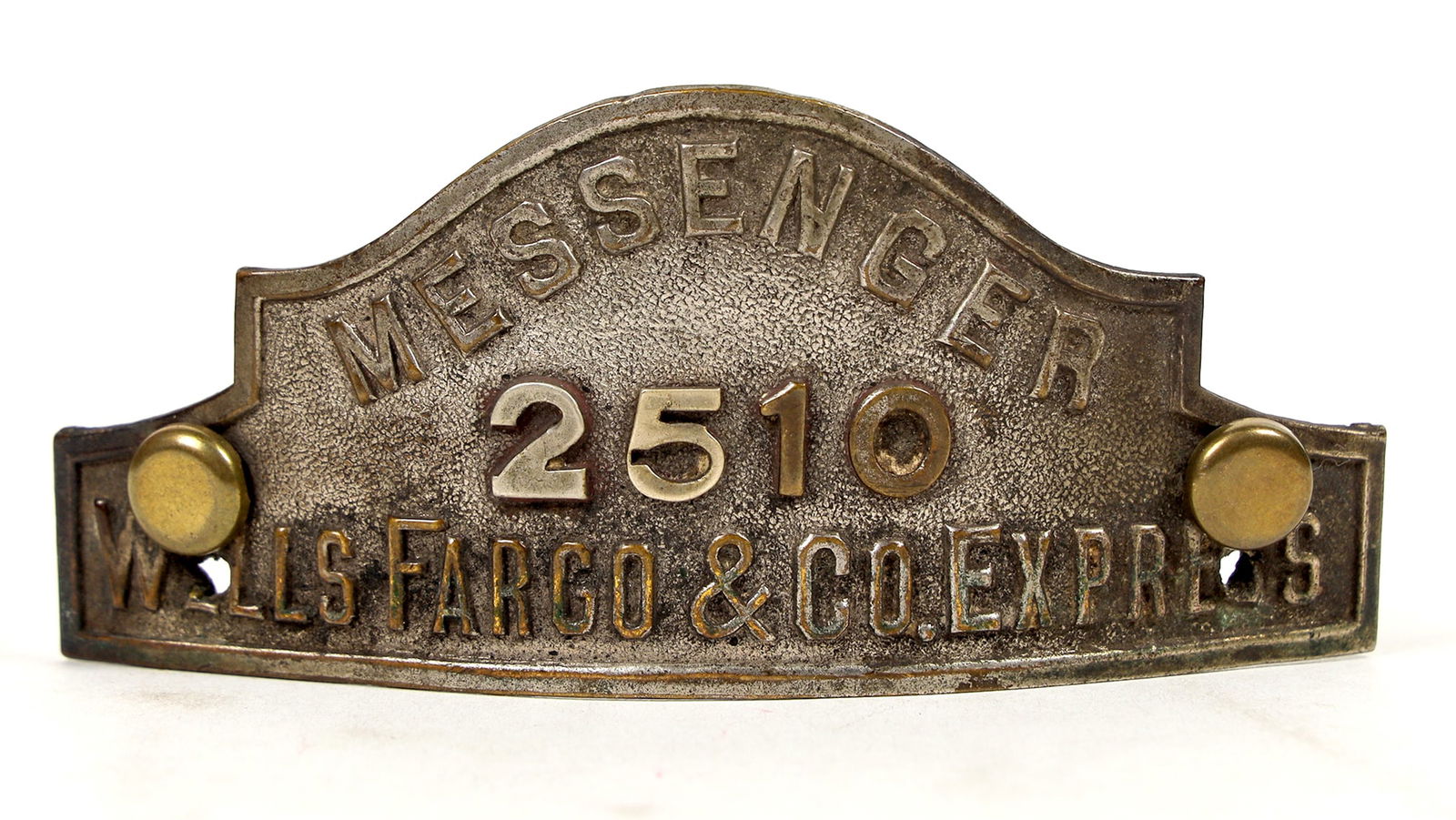 Wells, Fargo & Co. Messenger Hat Badge [205829]: This is a Wells, Fargo & Co. Express hat badge #2510 . 4 in. X 1.75 in. wide. Late 1800's early 1900s construction. Please see photo for details. ^Date: Country (if not USA): State: City: Provenance: