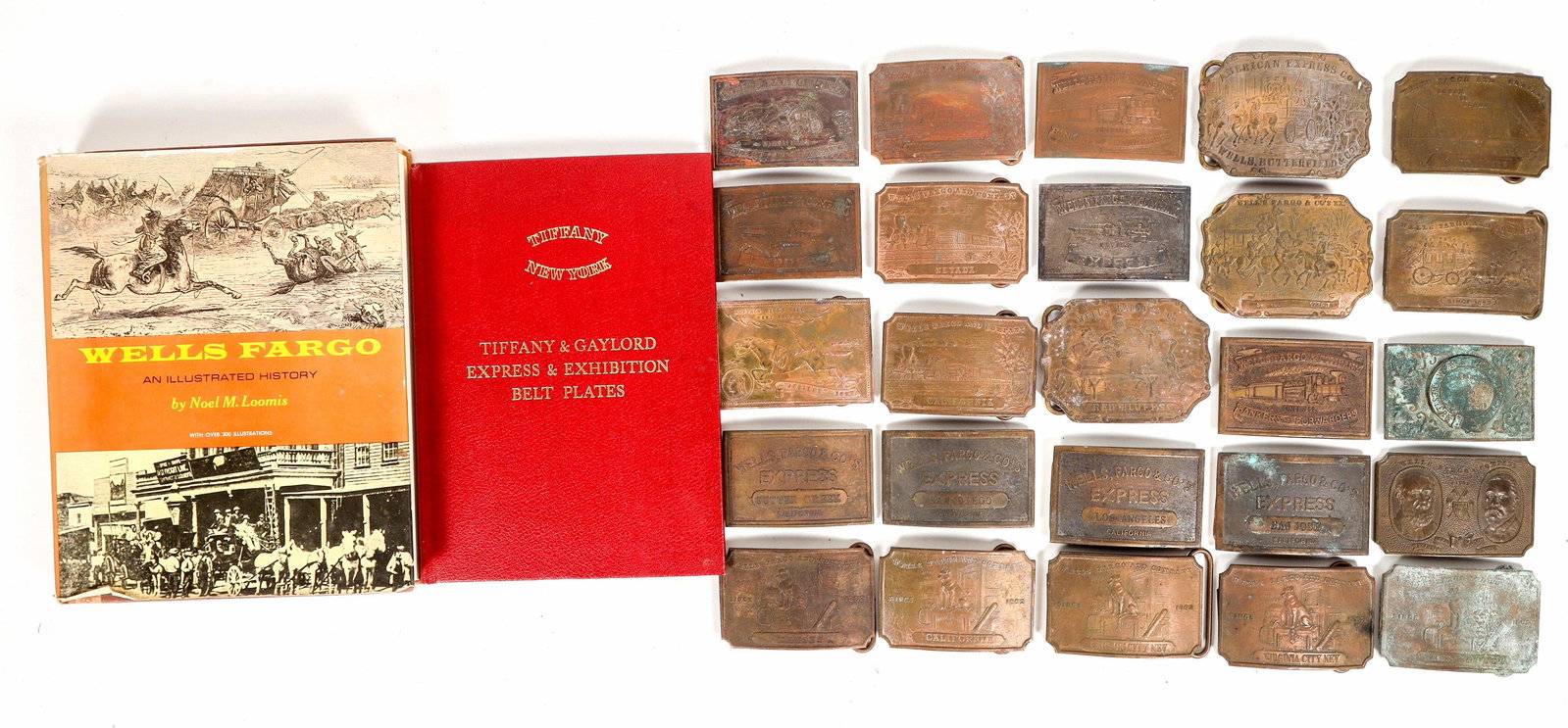 Wells Fargo Fantasy Brass Buckle Collection, c1960s (25) [203980]: These are fantasy pieces, not reproductions. 25 different, believed to be all made by John Fairchild if London in the 1960s. Distributed by Stan Lukowitz of the Bay area in the 1960s as a fun item for