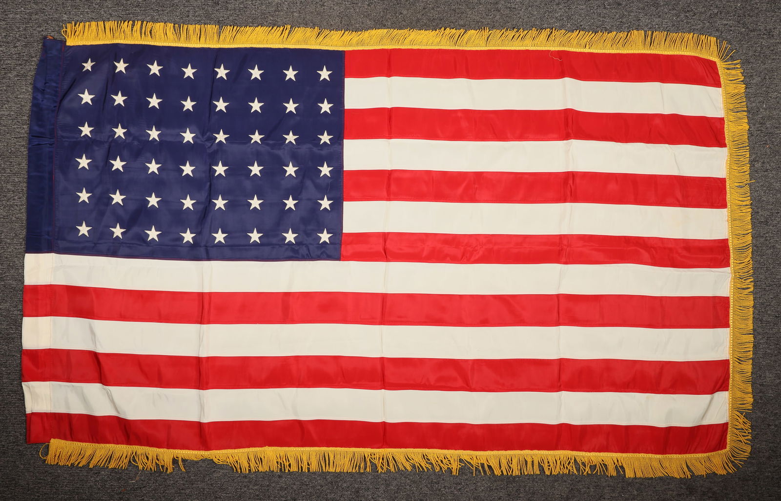 48 Star American Flag [204713]: 3x5". 48 star ceremonial American Flag w/g old fringe , possibly military. In Excellent condition. 48 star is pre-1959. ^Date: c1950'sCountry (if not USA): State: City: Provenance: