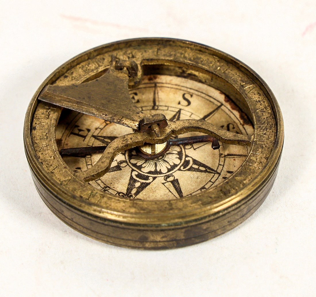 Vintage Sundial Compass c.1920's [202891]: This sundial compass was made in the 1920's without any makers mark. At 1.75 in. in diameter. The card is paper darkened with age. The needle is slow. Fine craftsmanship and the lid screws on; unlike