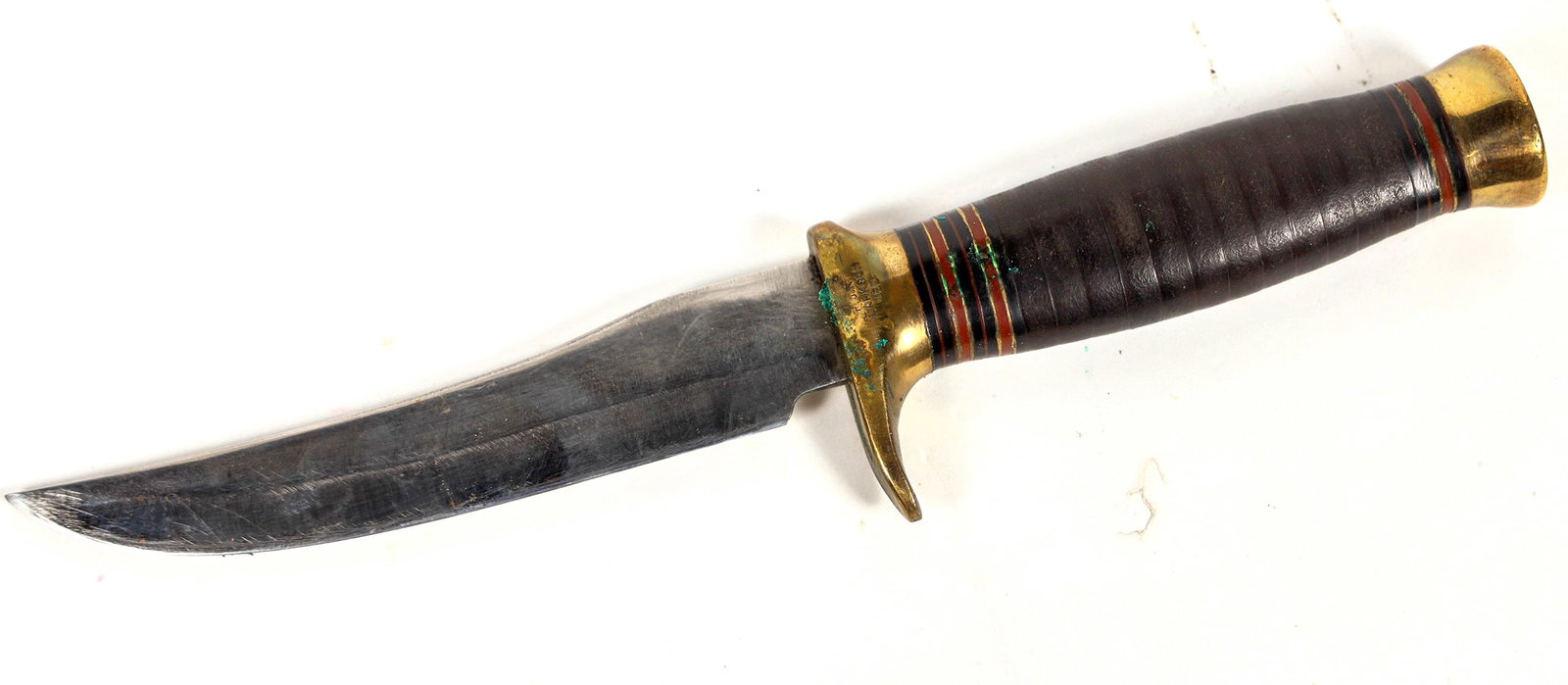 Frank J. Richtig Custom Hunter Knife with Lawrence Sheath C. 1930's [202928]: This hunting knife was made by Frank J. Richtig of Clarkson, Nebraska. It is 9.25 in. overall length with a 5 in. trailing point blade. It is marked "FJR/ Clarkson/ Neb." on the brass guard left side.