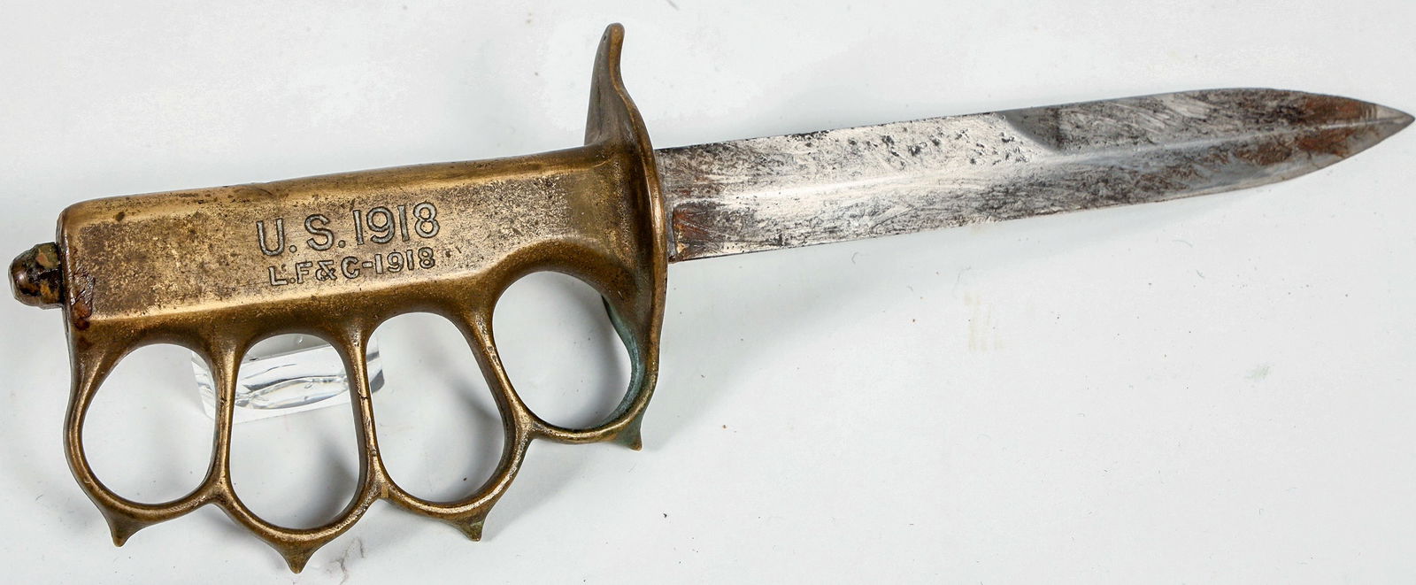 1918 LF& C Trench Knife with Sheath [202919]: This is a trench knife made by Landers, Frary & Clark of New Berlin, Conn. dated 1918. The knife appears to have been repaired at some point with a replacement blade and skull crusher nut. The brass k