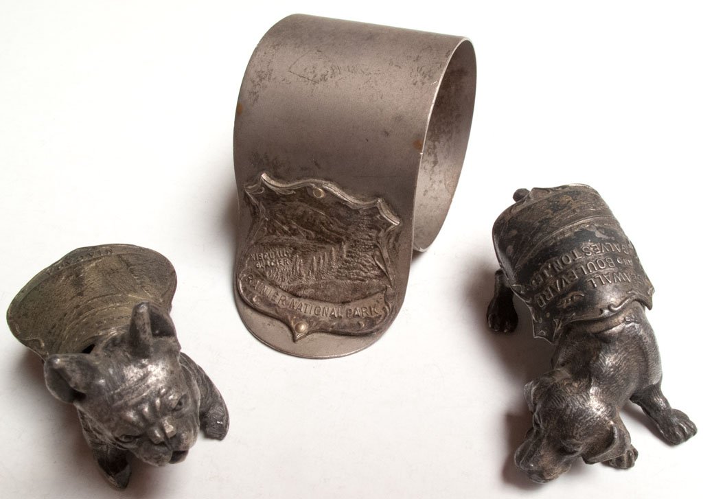 Group of three souvenirs: 1) Napkin Ring, Rainier National Park (Washington). 2) Dog, Prospect Point, Niagara Falls (New York). 3) Dog, Seawall and Boulevard. Galveston, Texas.