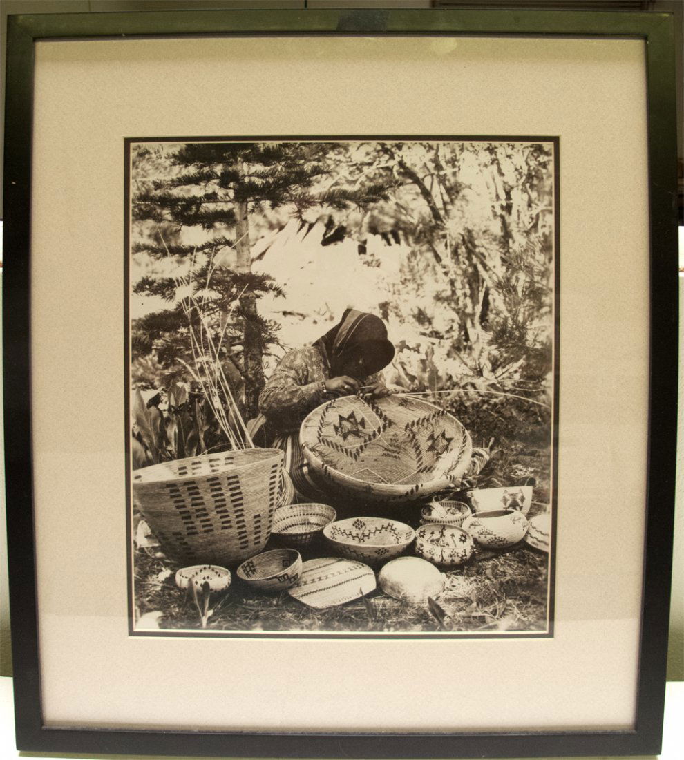 Dat So La Lee At Work In Enlarged Photograph In Frame