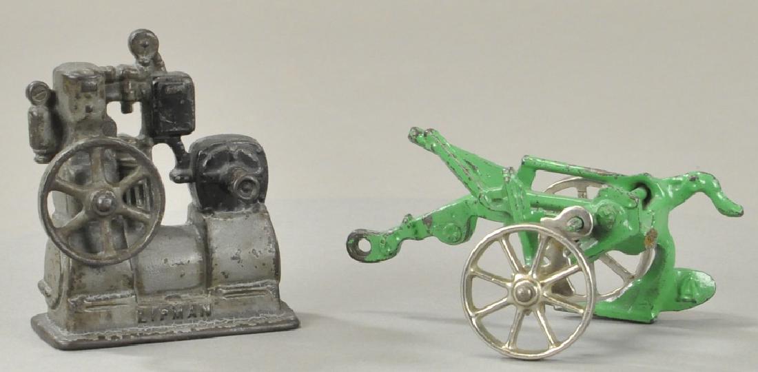 PAIR OF CAST IRON FARM IMPLEMENTS (1 of 3)