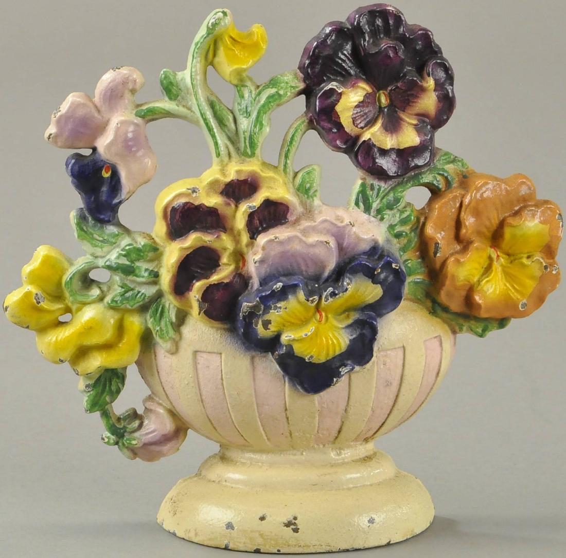 PANSY BOWL DOORSTOP: Hubley "256," pink pot version, beautiful and realistic colors, multi-colored pansies in cream and pink striped base. 7" h.
