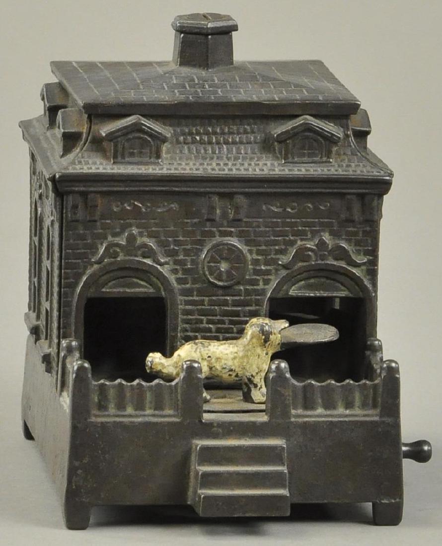 JUDD DOG ON TURNTABLE - WHITE DOG VERSION: Judd Mfg. Co., circa 1870's, turn handle, the dog goes in and deposits penny, coming out of the other door for more.