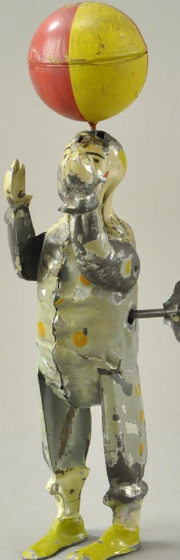 CLOWN JUGGLING BALL ON HEAD (1 of 3)