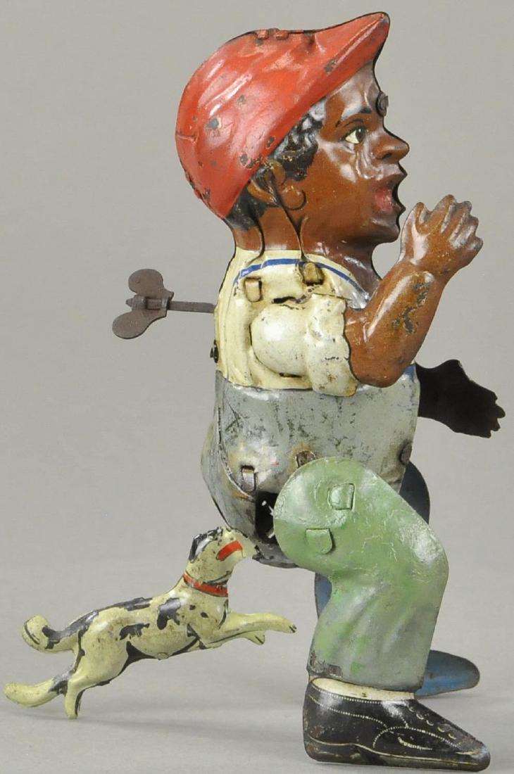 DOG CHASING BOY CLOCKWORK TOY (1 of 4)
