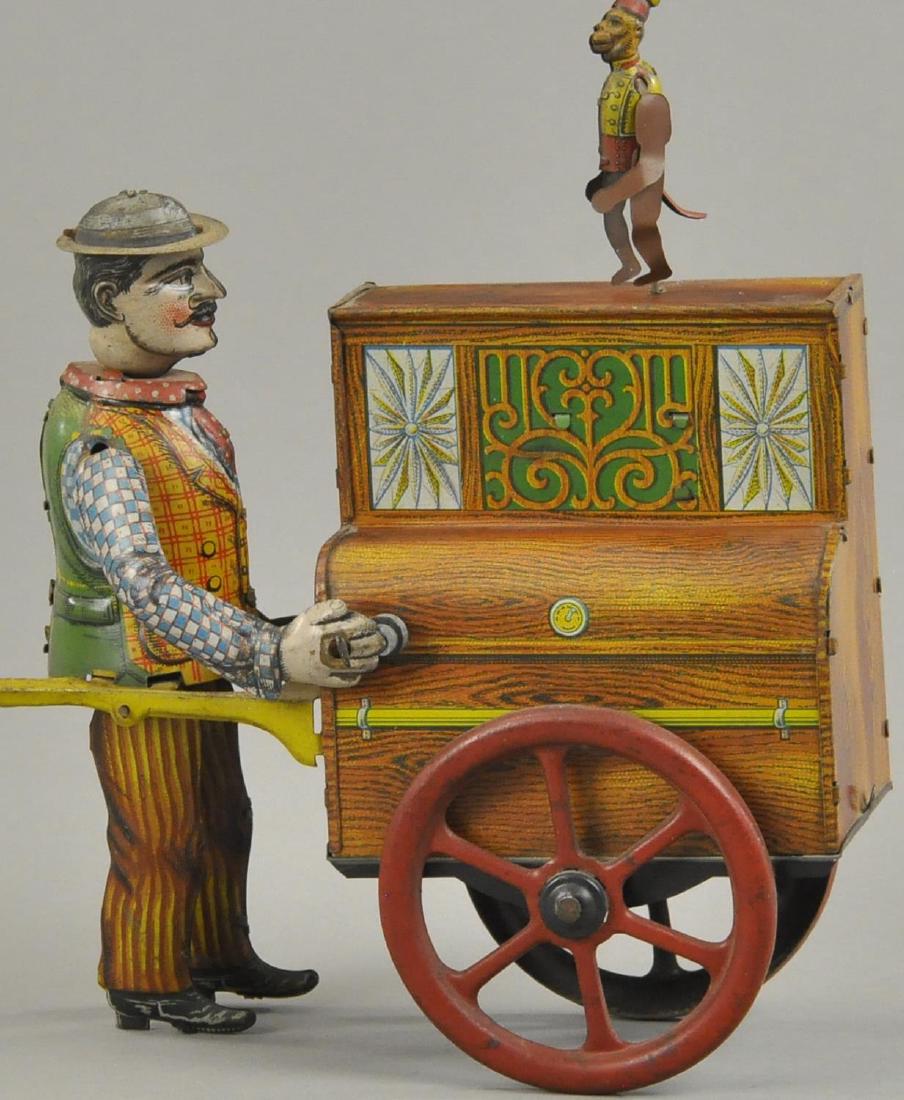 ORGAN GRINDER WITH PERFORMING MONKEY (1 of 2)