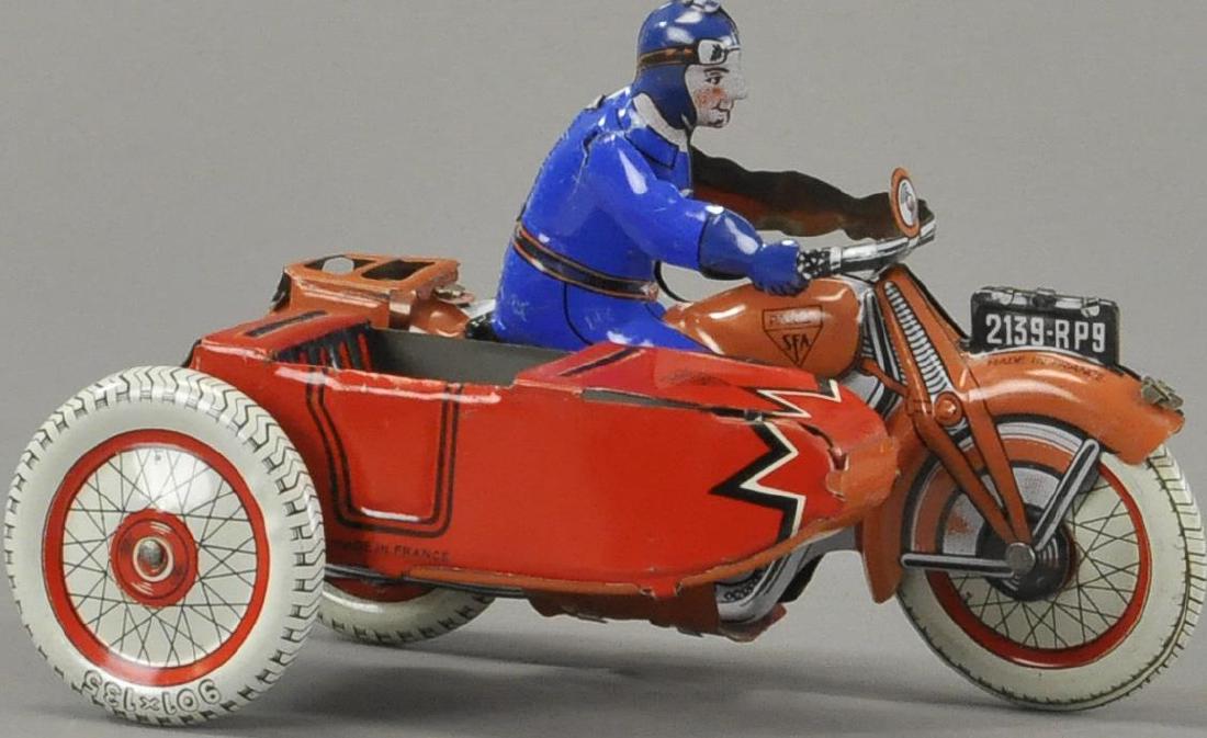 SFA MOTORCYCLE WITH SIDECAR: France, lithographed tin civilian rider in blue outfit, features lithographed sidecar, luggage rack on rear of cycle, wind-up action. 6 1/2" l.