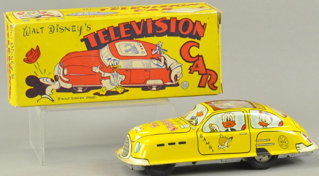 BOXED WALT DISNEY TELEVISION CAR: Litho tin friction toy in working condition, Walt Disney Productions car depicts litho images of Disney characters, small TV screen on roof pictures Mickey and Donald, box included. 7 1/4" l.