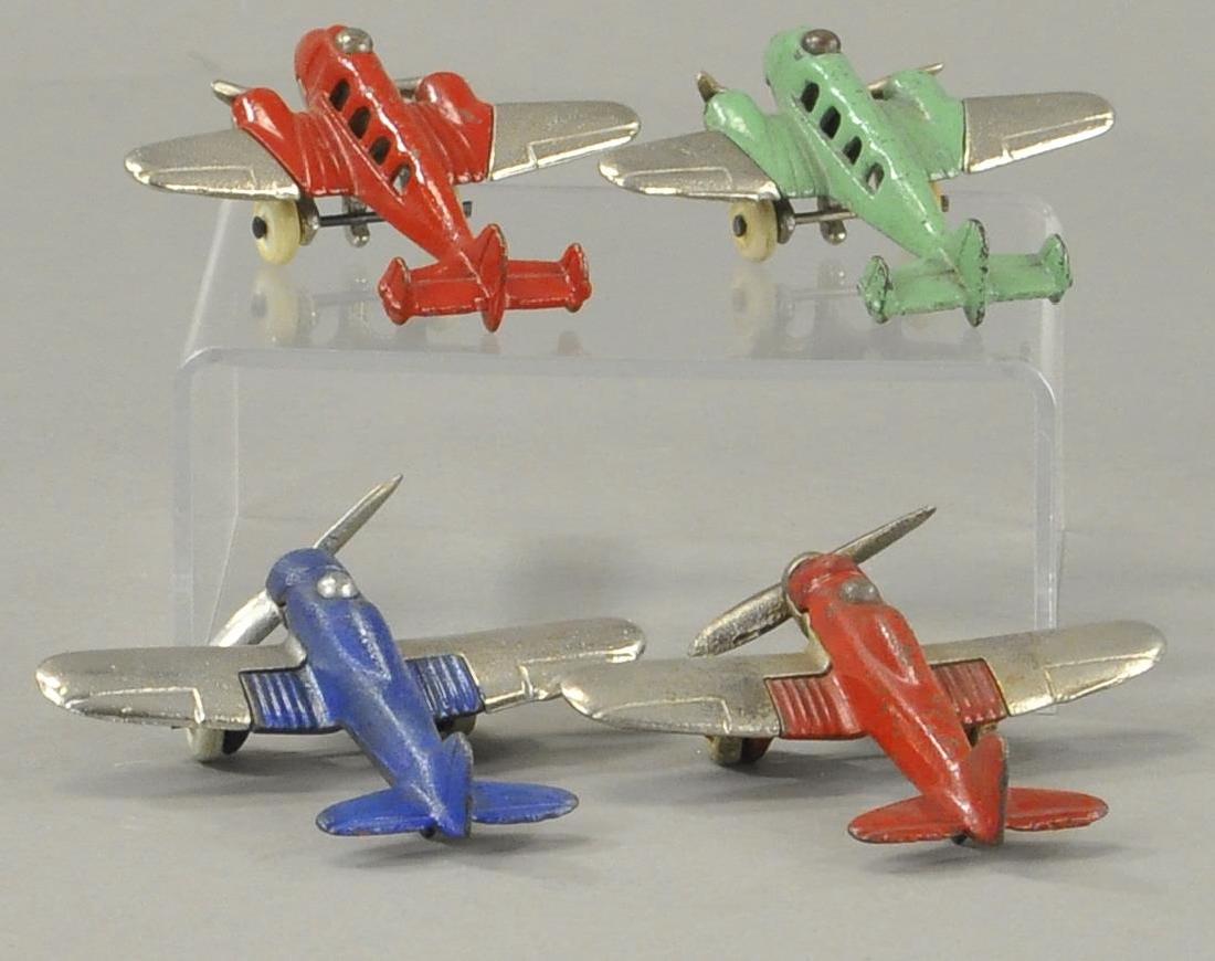 FOUR SMALL IRON AIRPLANES (1 of 3)
