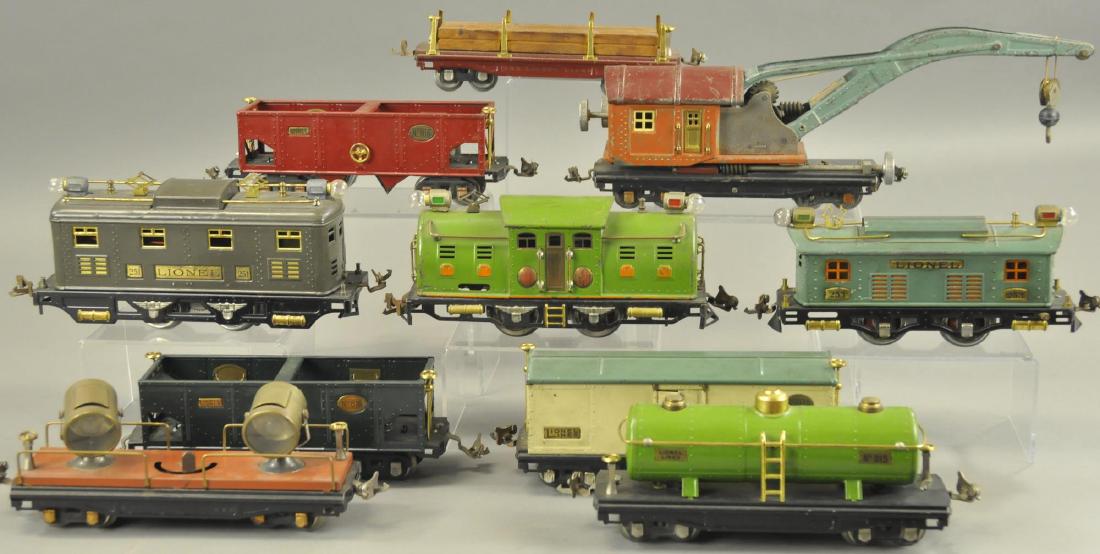 THREE PRE-WAR LIONEL LOCOMOTIVES AND FREIGHT CARS (1 of 3)
