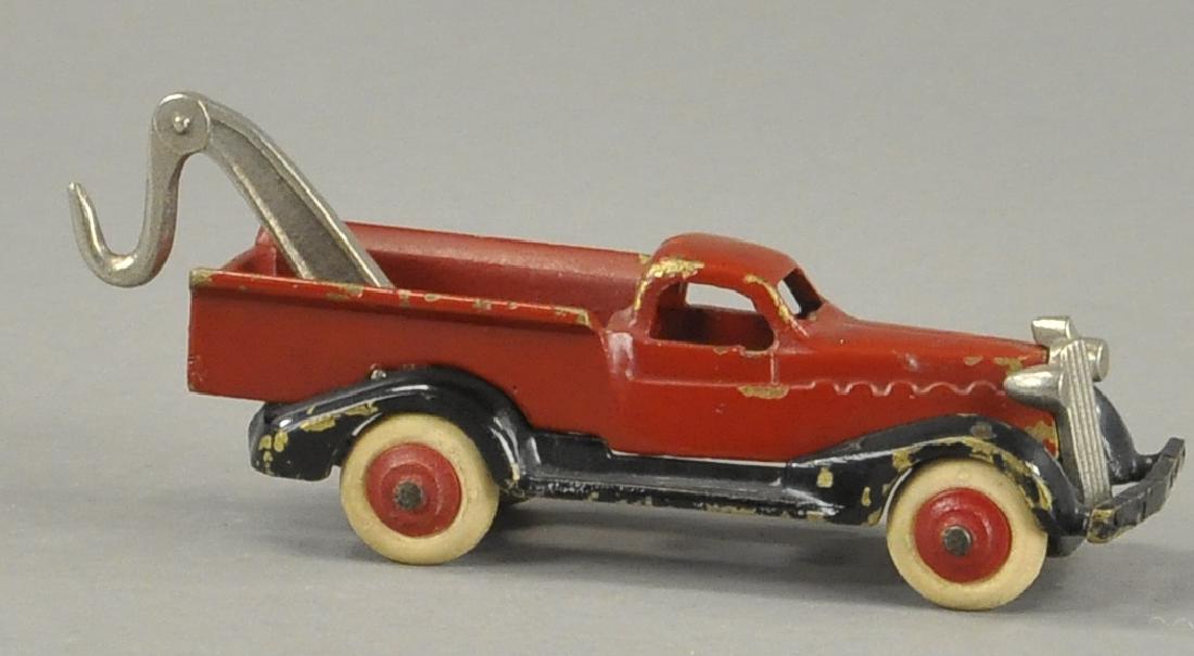 DENT TAKE-APART WRECKER TRUCK - BRASS: Scarce, a nice pair to the yellow van, this wrecker appears to be made of brass, nickel grille and wrecker appointments. 5" l.