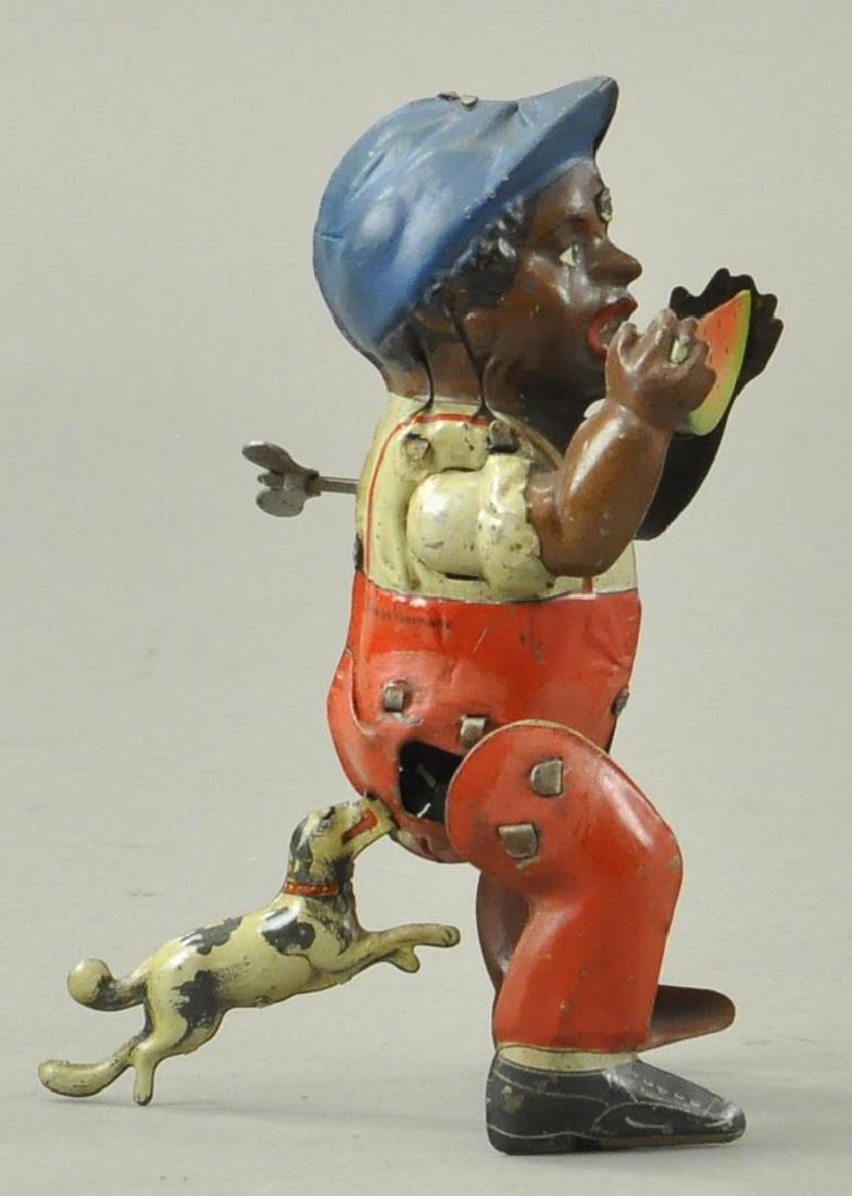 DOG CHASING BOY CLOCKWORK TOY (1 of 3)