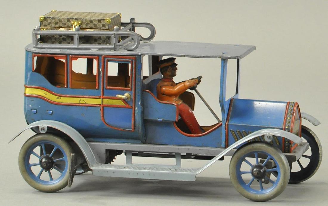 HANS EBERL LIMOUSINE: Germany, c. 1910, large blue limo with yellow color striping, features roof rack, seated driver, full running boards, and rivet design grille,spoke wheels done in blue, clockwork driven. 11" l.
