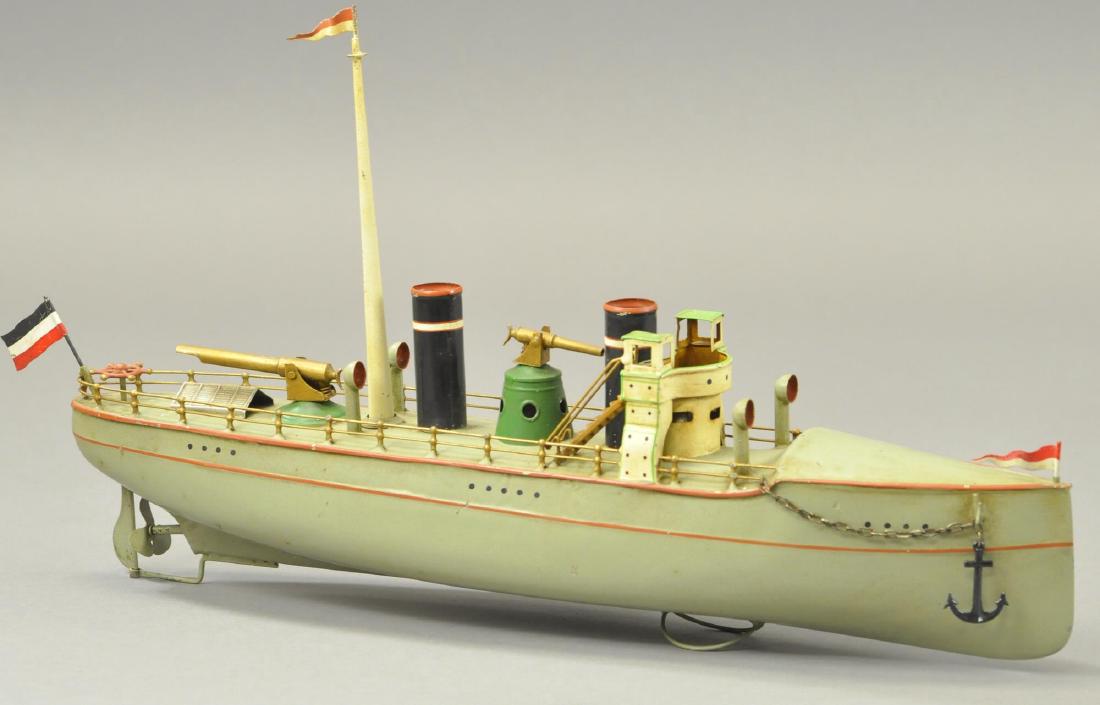 CARETTE GUNBOAT: Sleek gunboat shaped for speed and features a clean styled hull, large intimidating gun sits above deck towards the stern, between stacks sits another cannon atop a green pedestal. 17.75" l.