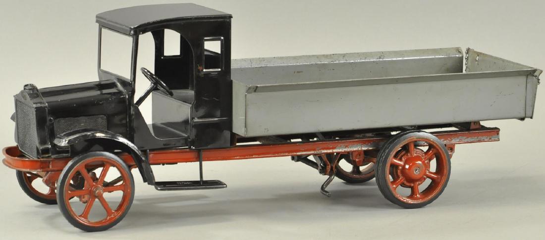 KELMET BURDETTE MURRAY DUMP TRUCK: Pressed steel, c. 1920's, this all original very limited production model made specifically by Kelmet Corp. features spoke and dual wheel rubber tires, cast metal radiator grille, and gray color dump