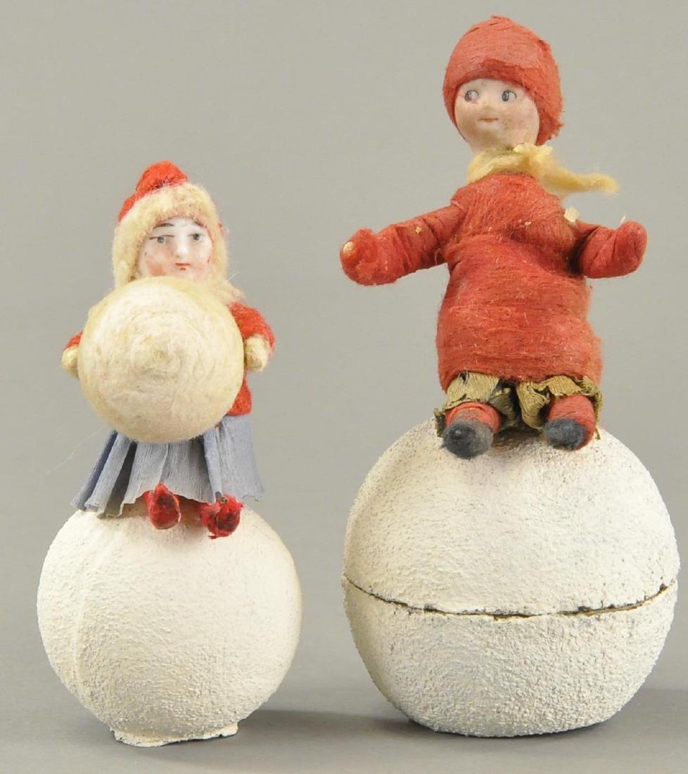 TWO CHILDREN ON SNOWBALLS (1 of 2)