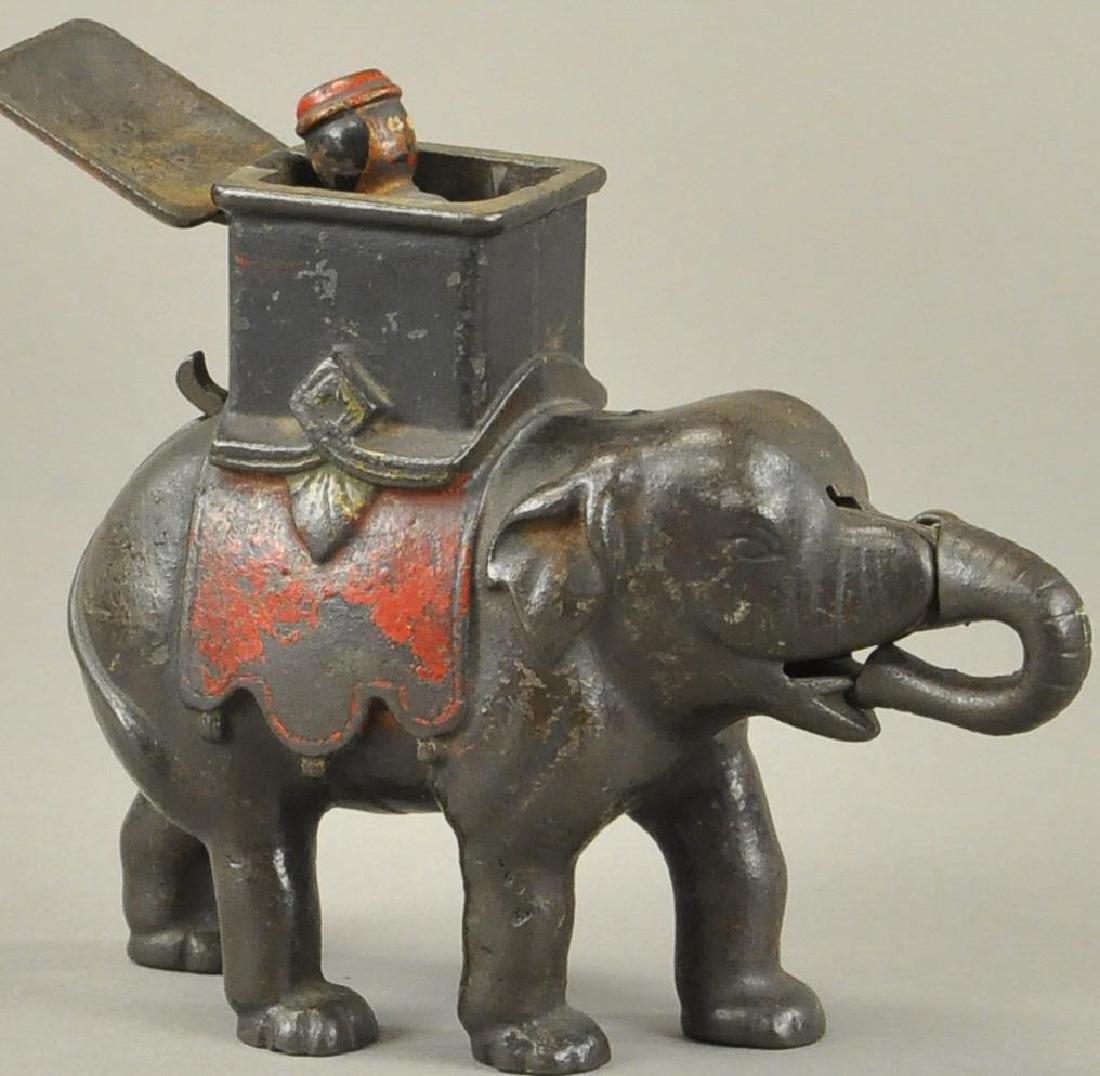ELEPHANT WITH HOWDAY MECHANICAL BANK - MAN POPS (1 of 4)