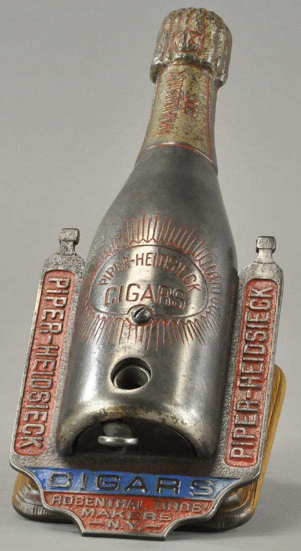 PIPER-HEIDSIECK BOTTLE, CIGAR CUTTER (1 of 3)