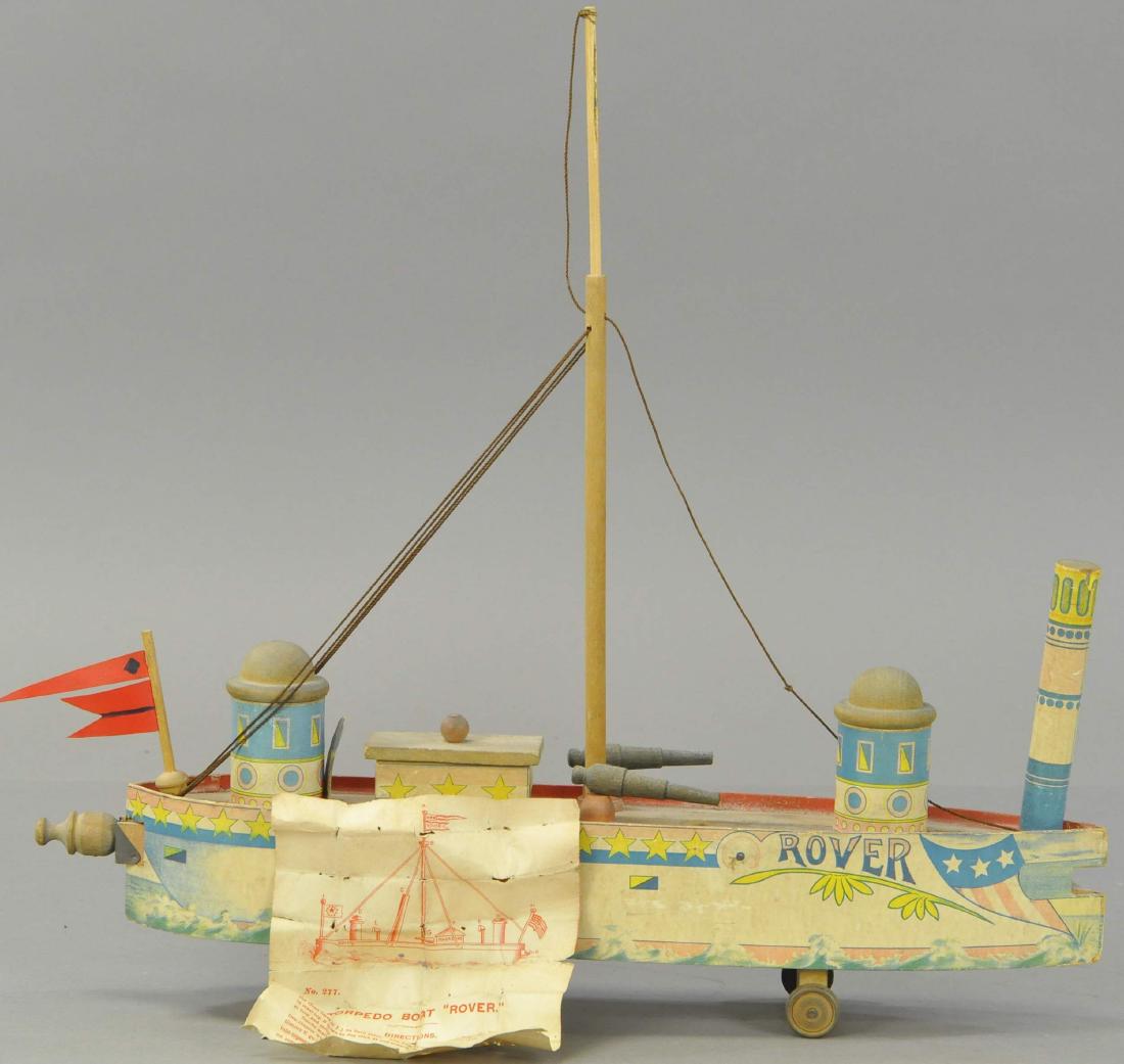 BLISS BATTLESHIP ROVER W/ INSTRUCTIONS: 1250. BLISS BATTLESHIP ROVER W/ INSTRUCTIONS | Flag at rear is replaced, otherwise in All Original Condition. | 19.5" l.