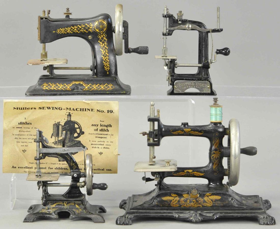 FOUR CAST IRON SEWING MACHINES (1 of 3)