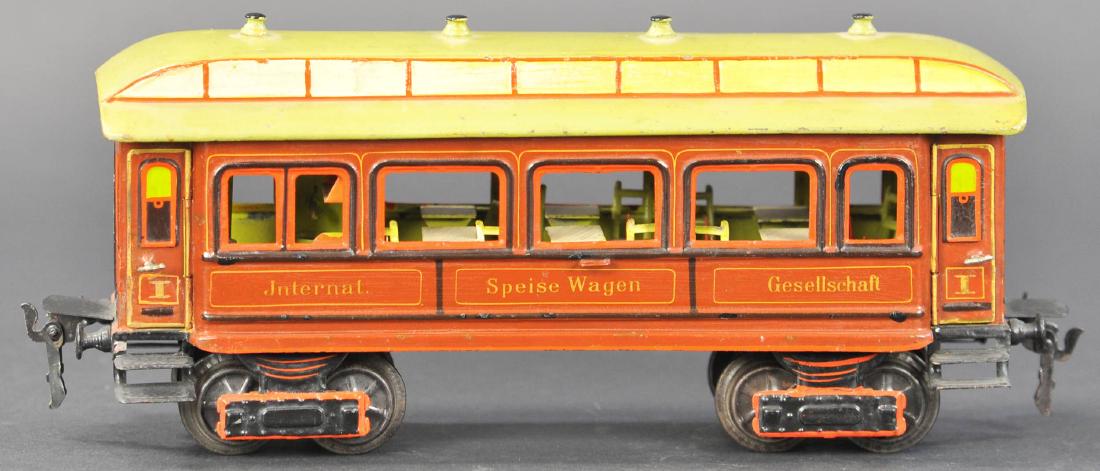 MARKLIN PASSENGER COACH: 56. MARKLIN PASSENGER COACH | Germany, 1 gauge, hand painted Marklin passenger car for the European market, has detailed interior with tables and chairs, four opening doors, and Marklin's classic hand