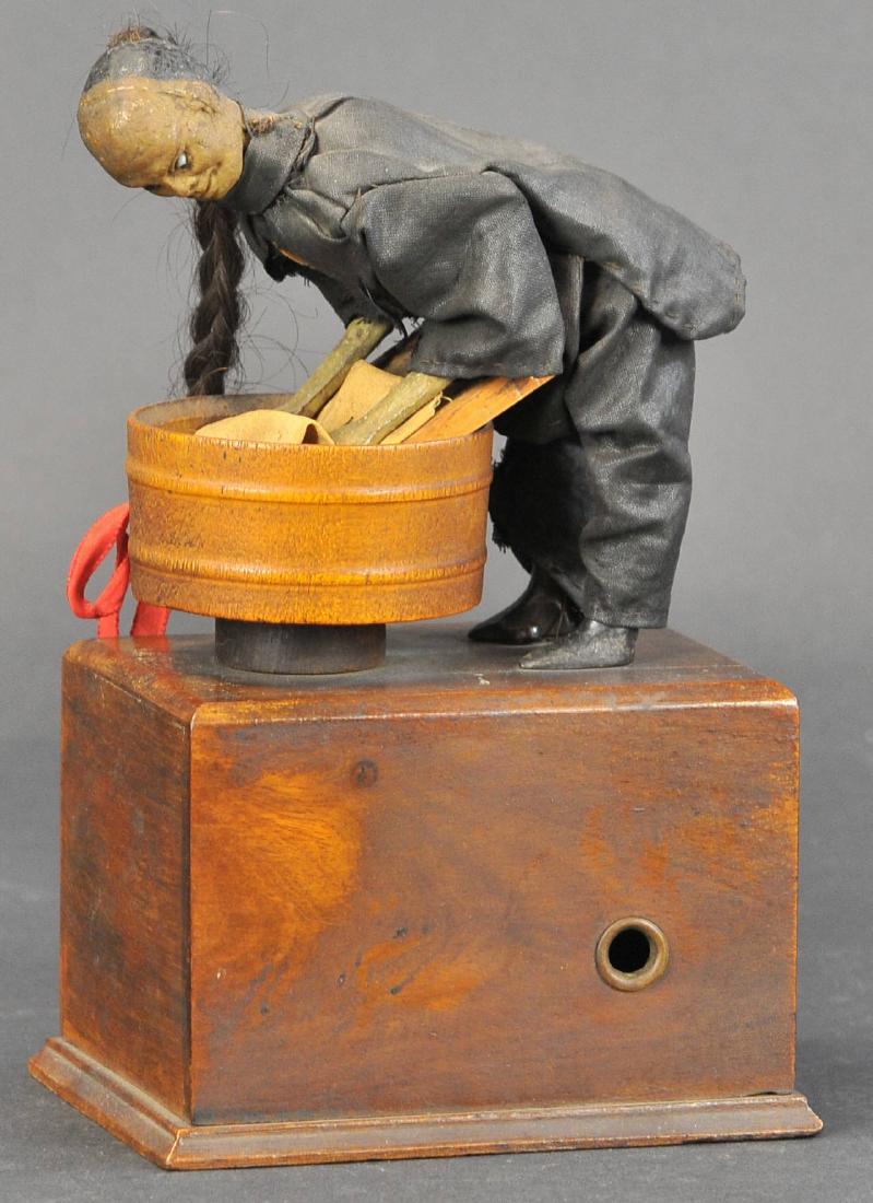 IVES CHINESE LAUNDRY MAN: 285. IVES CHINESE LAUNDRY MAN | An opportunity to own an incredible piece, reportedly only known example, clockwork driven action depicts Chinaman in full attire and long queue working in laundry wash