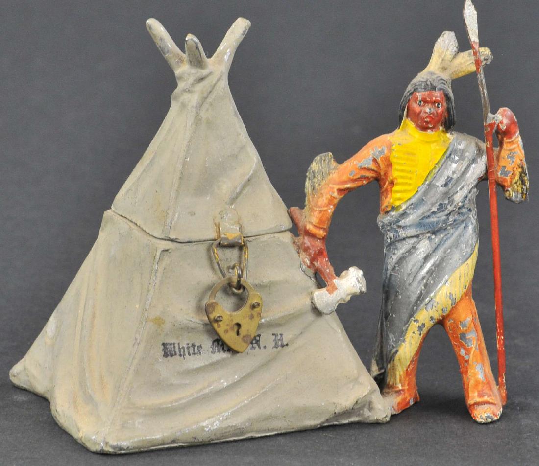 INDIAN WITH TEEPEE SPELTER STILL BANK: 330. INDIAN WITH TEEPEE SPELTER STILL BANK | European, front of teepee reads White Mountains, NH. 3.5"