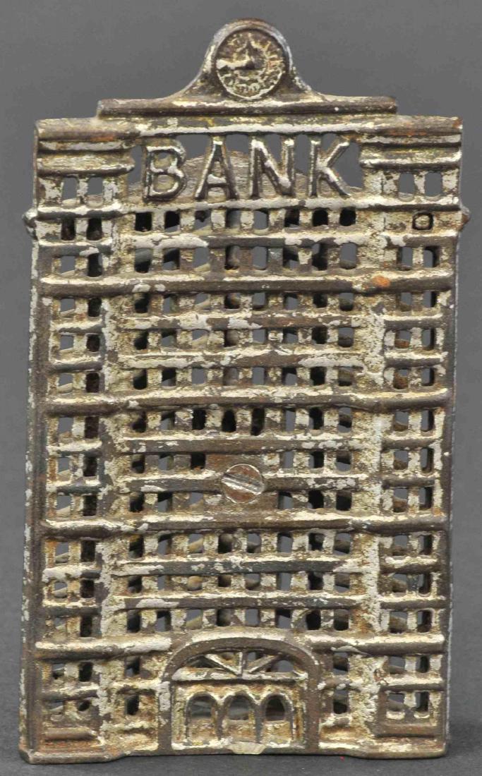 TRIANGULAR BUILDING W/ CLOCK BANK (1 of 2)