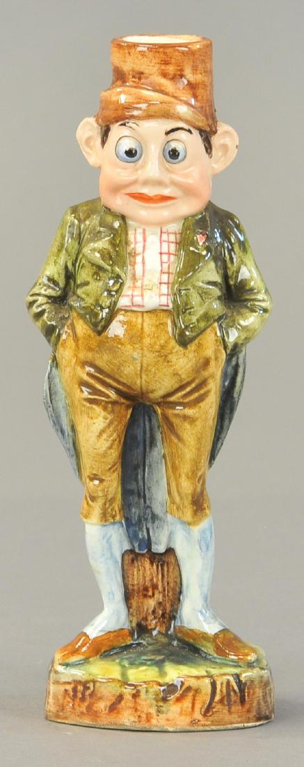 MAJOLICA PALMER COX DANDY: 123. MAJOLICA PALMER COX DANDY | Well dressed Brownie, long green tail coat, candle holder. 7.5" h.