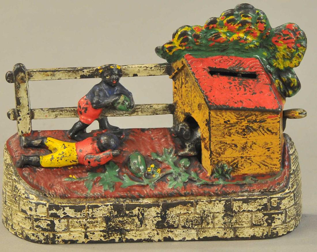 BOY STEALING WATERMELON MECHANICAL BANK (1 of 2)